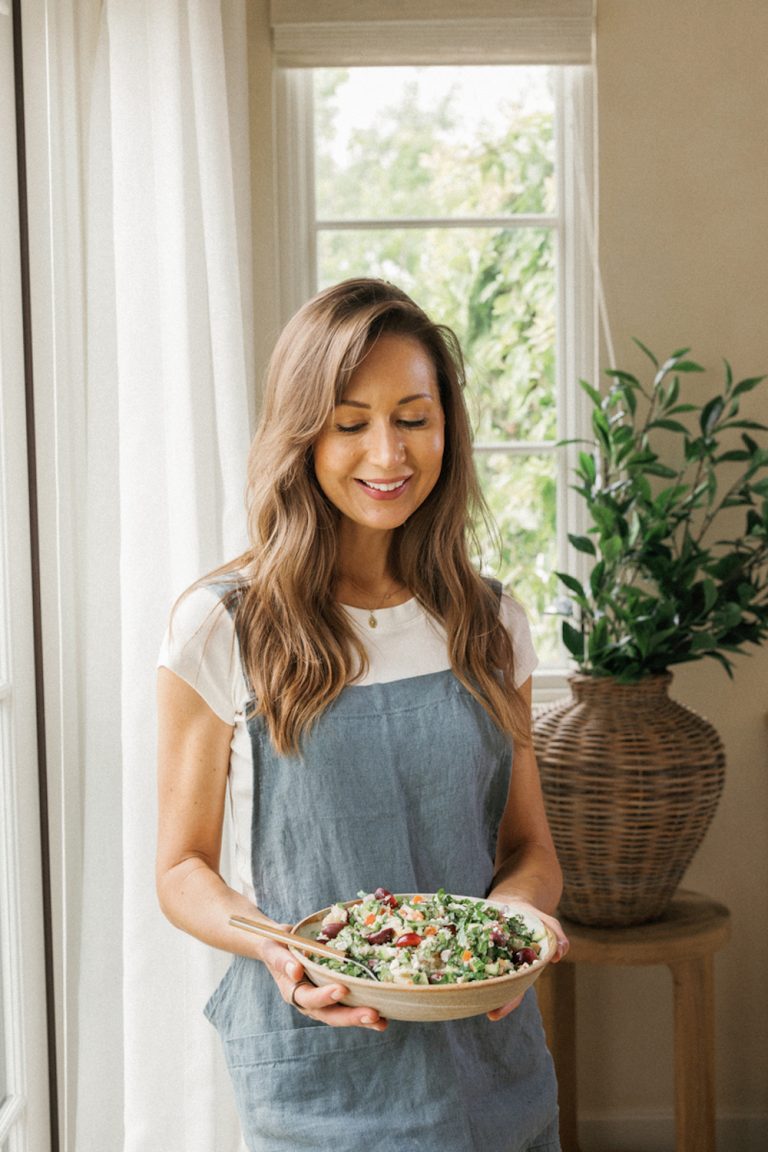 Camille Styles holding grain bowl.