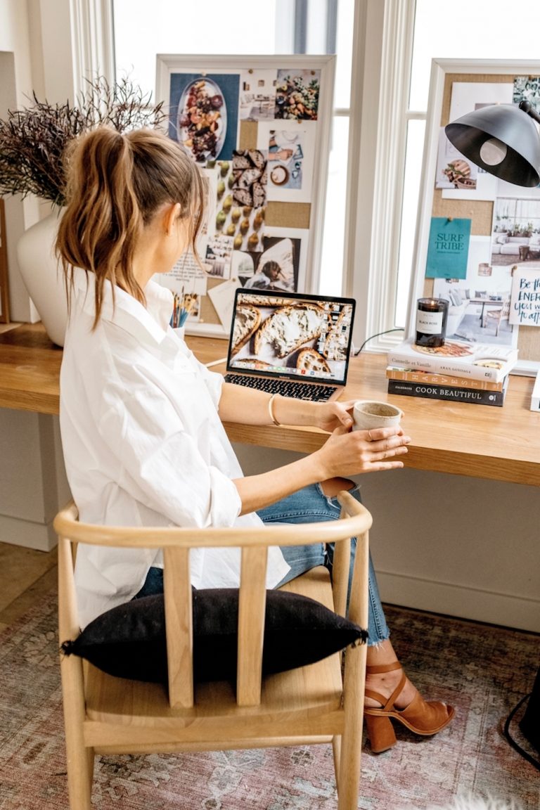 Brunette woman sitting at desk.