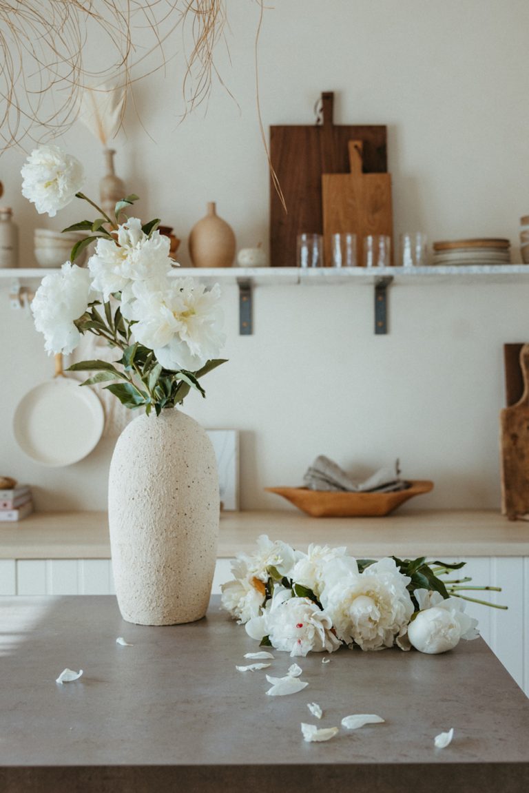 Vase of white peonies.