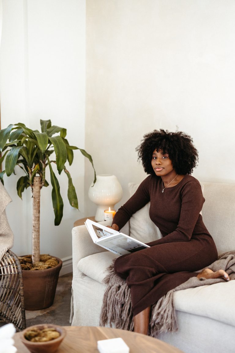 Woman reading on couch.