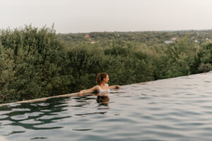 Woman outside in pool.