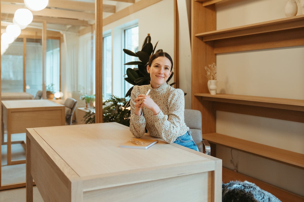 Adriene Mishler sitting at her desk in her office in Austin, Texas.