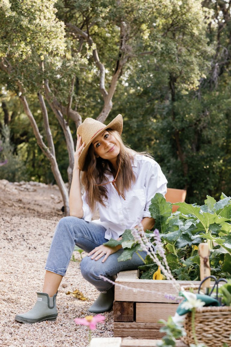 Camille Styles gardening outside.