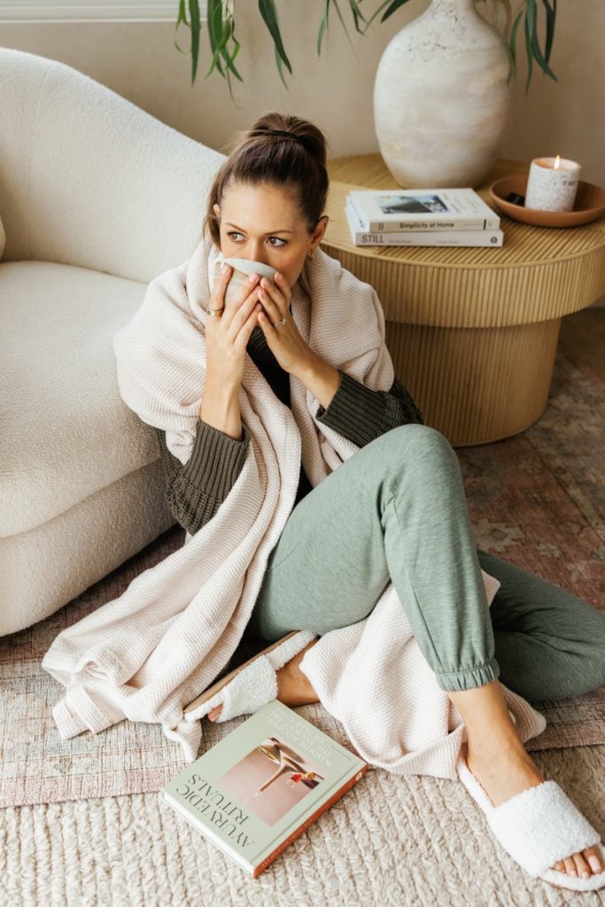 Camille Styles with cup of tea and blanket