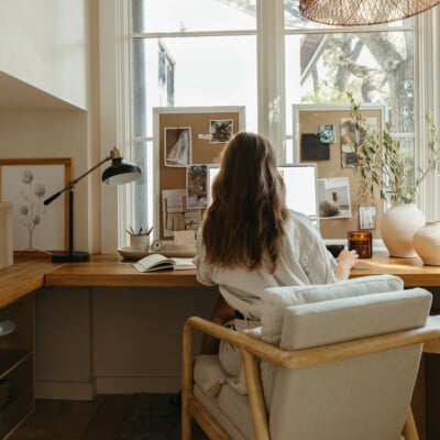 Camille Styles working at desk