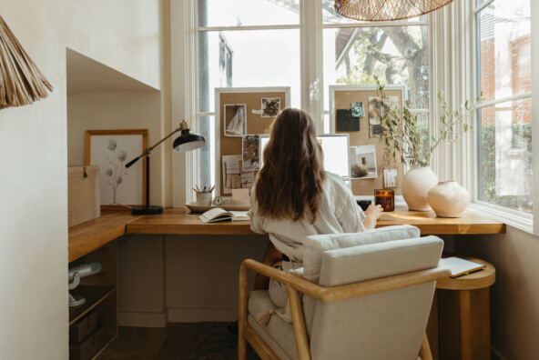 Camille Styles working at desk_wellness practices