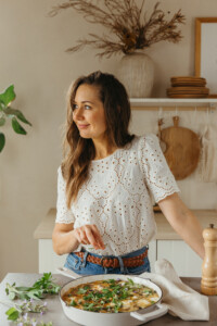 woman standing in kitchen with fritatta_are my supplements working
