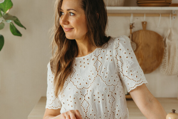 woman standing in kitchen with fritatta