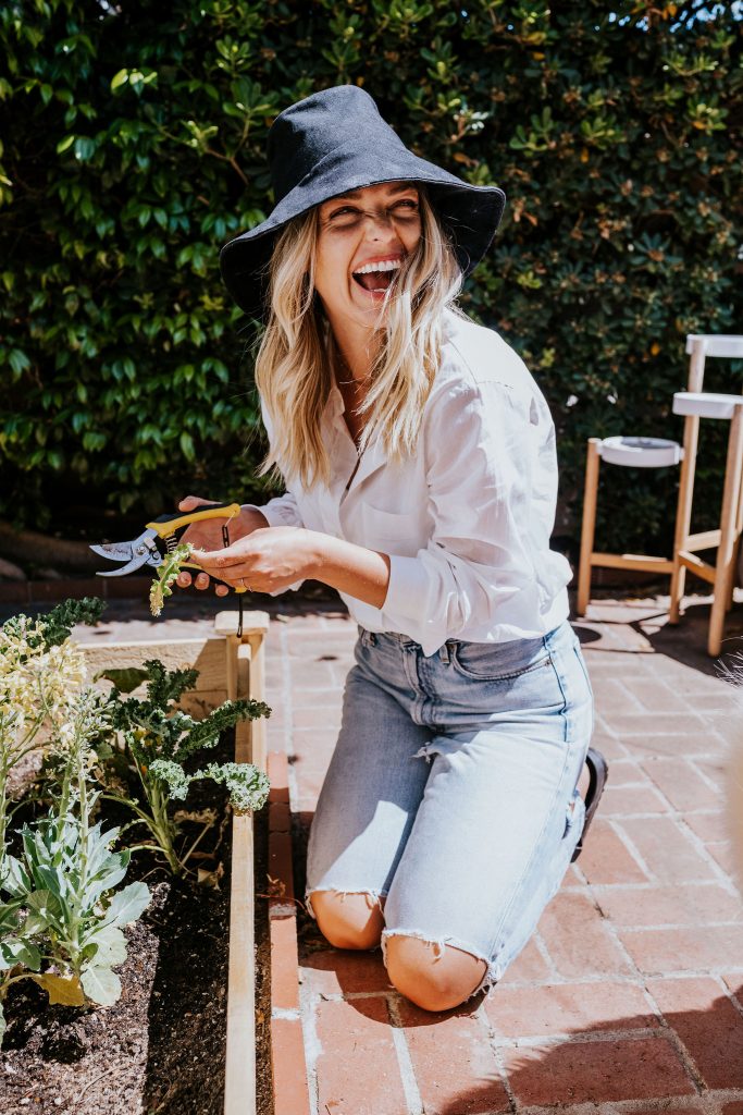 Woman outside gardening.