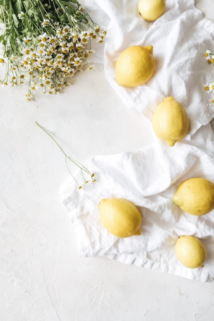 Lemons on white tablecloth.
