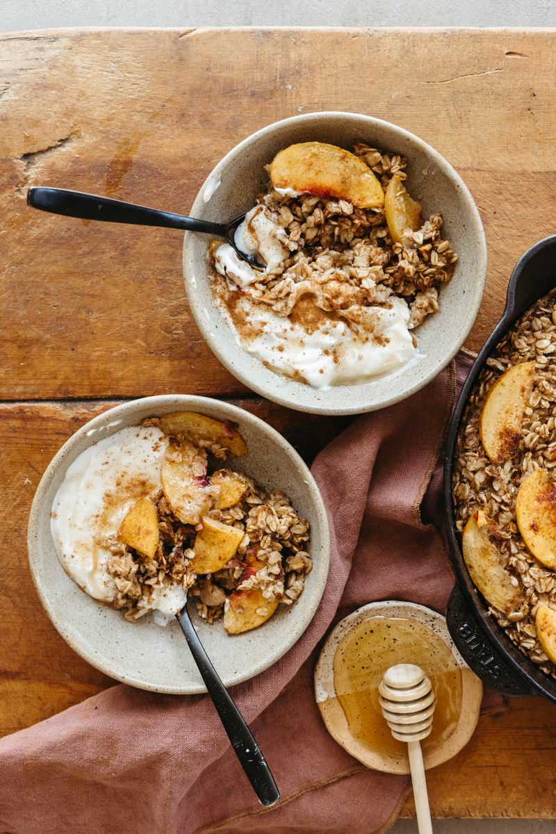 peach oatmeal bake with greek yogurt in bowls