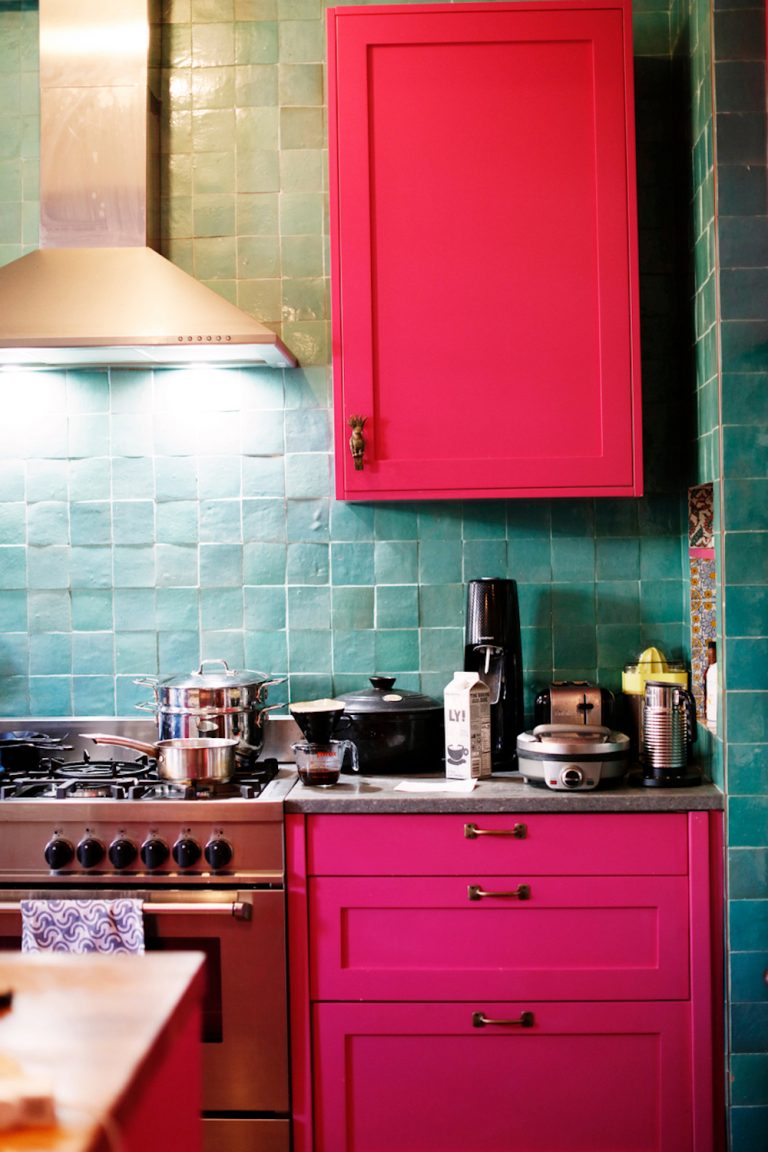 Bright pink kitchen cabinets.