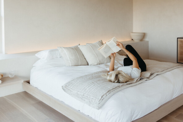 Woman reading on bed_luteal phase