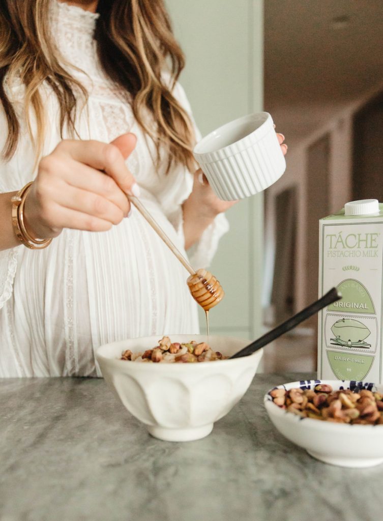 Roxana Saidi pouring honey on cereal_anti inflammatory recipe