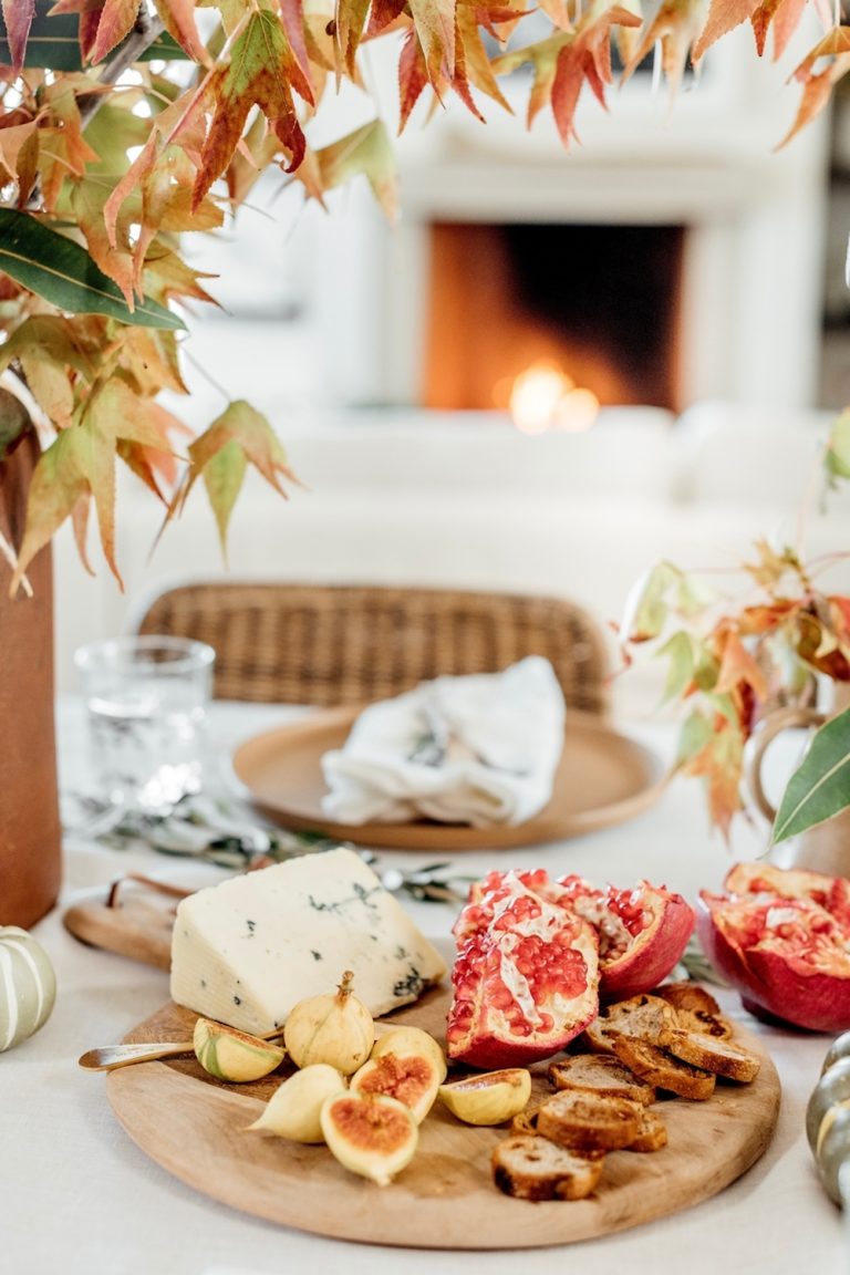 Fall cheeseboard with blue cheese, pomegranate, and figs.