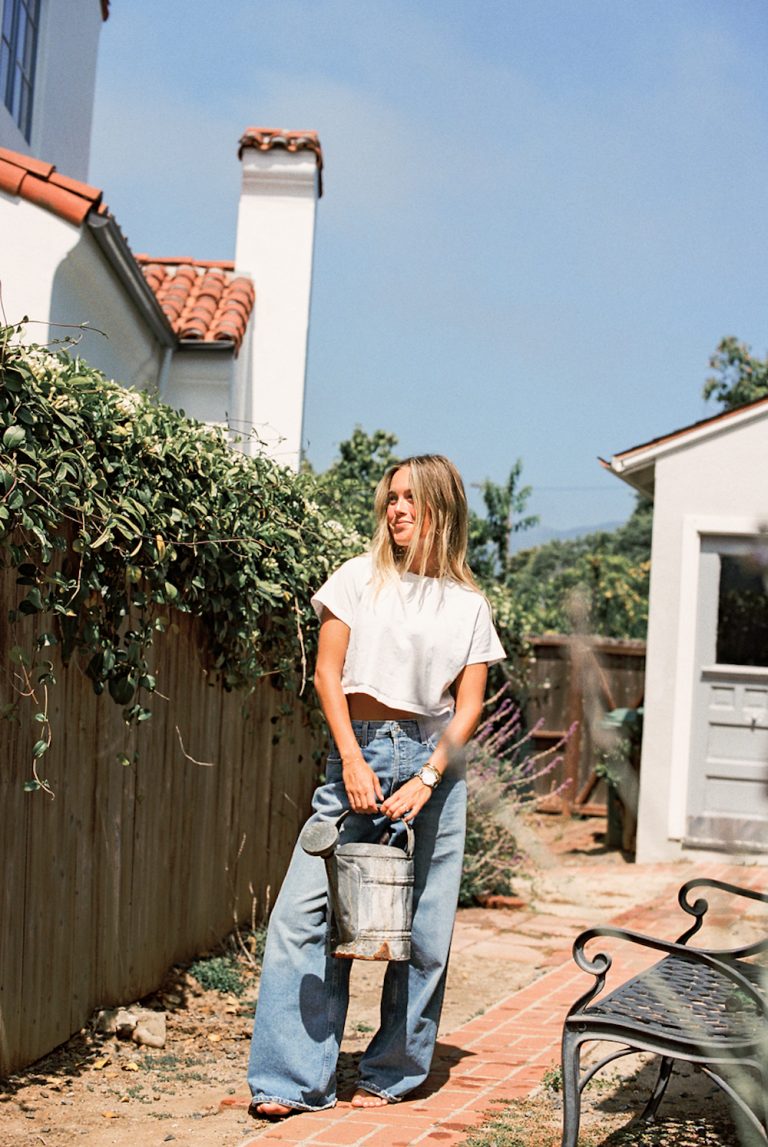 Woman wearing  fall 2023 denim trends outside.