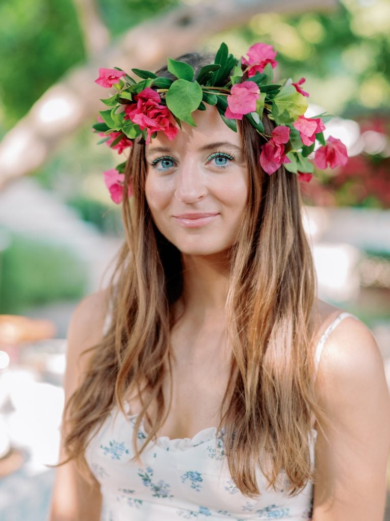 woman with blue eyes wearing flower crown