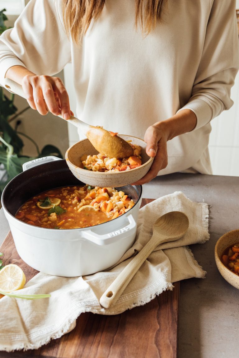 Serving vegetarian stew.