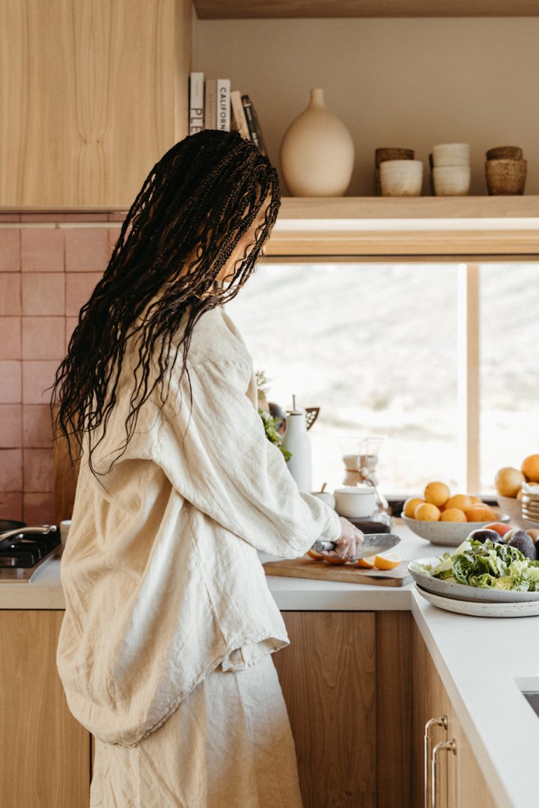 Woman cooking in kitchen.