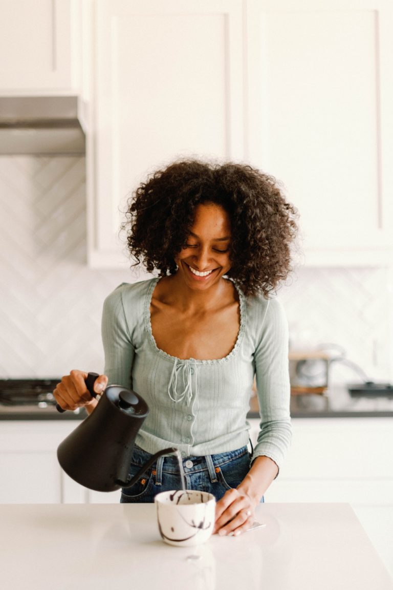 Woman pouring tea.