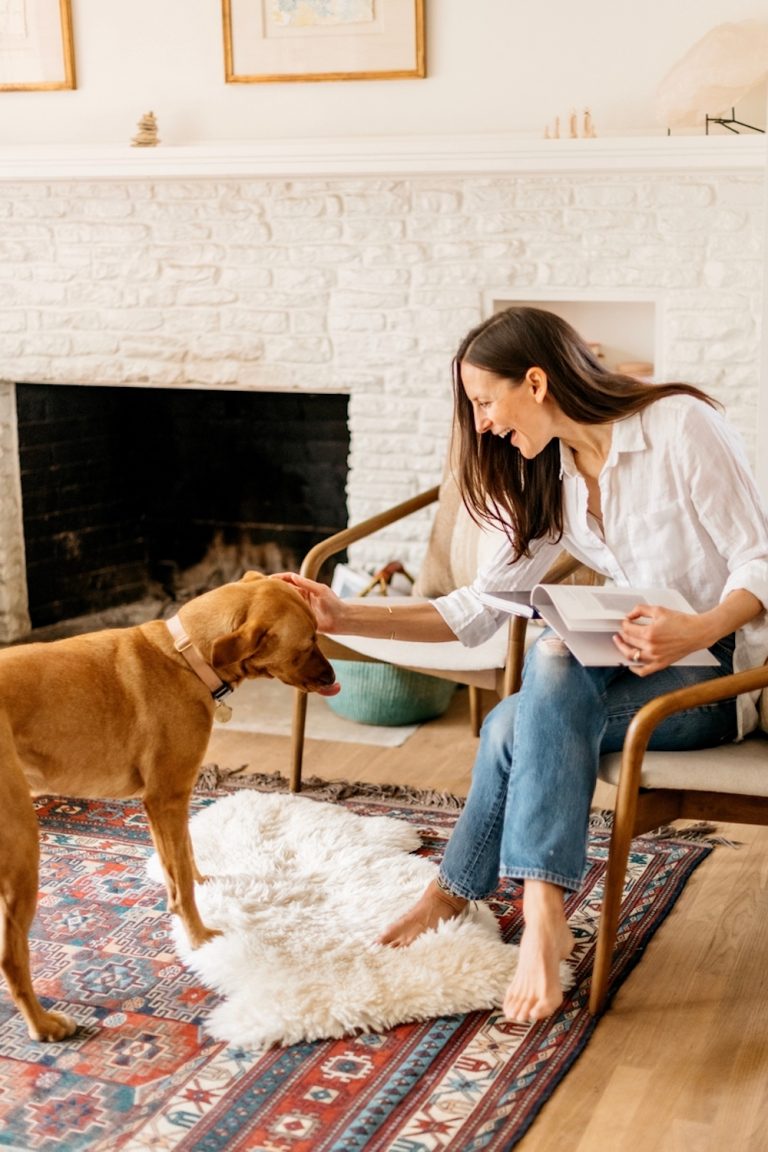 Woman petting dog.