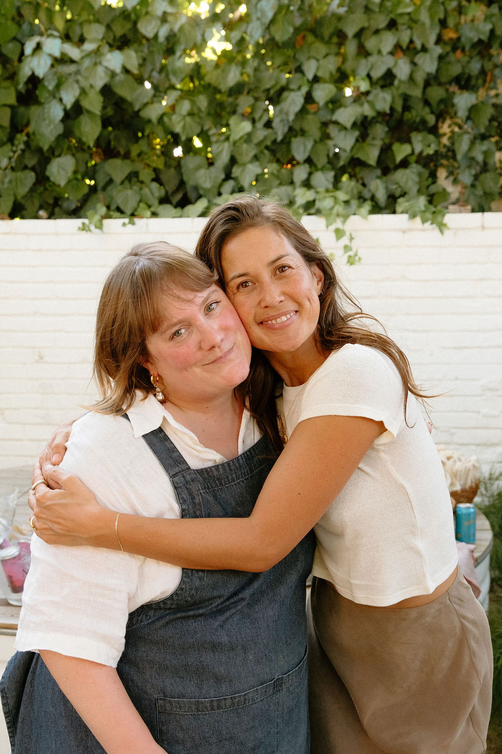 Two women hugging.