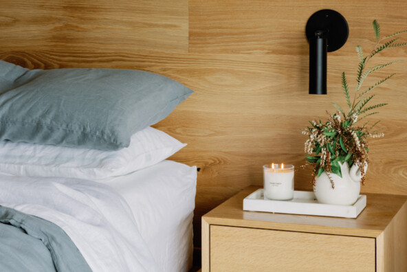 Calming bedroom with candle.