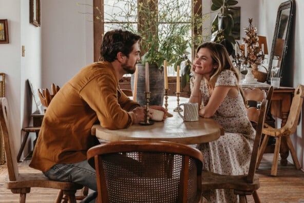 Couple sitting at table.