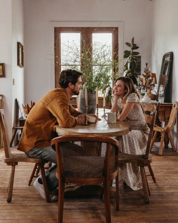 Couple sitting at table.