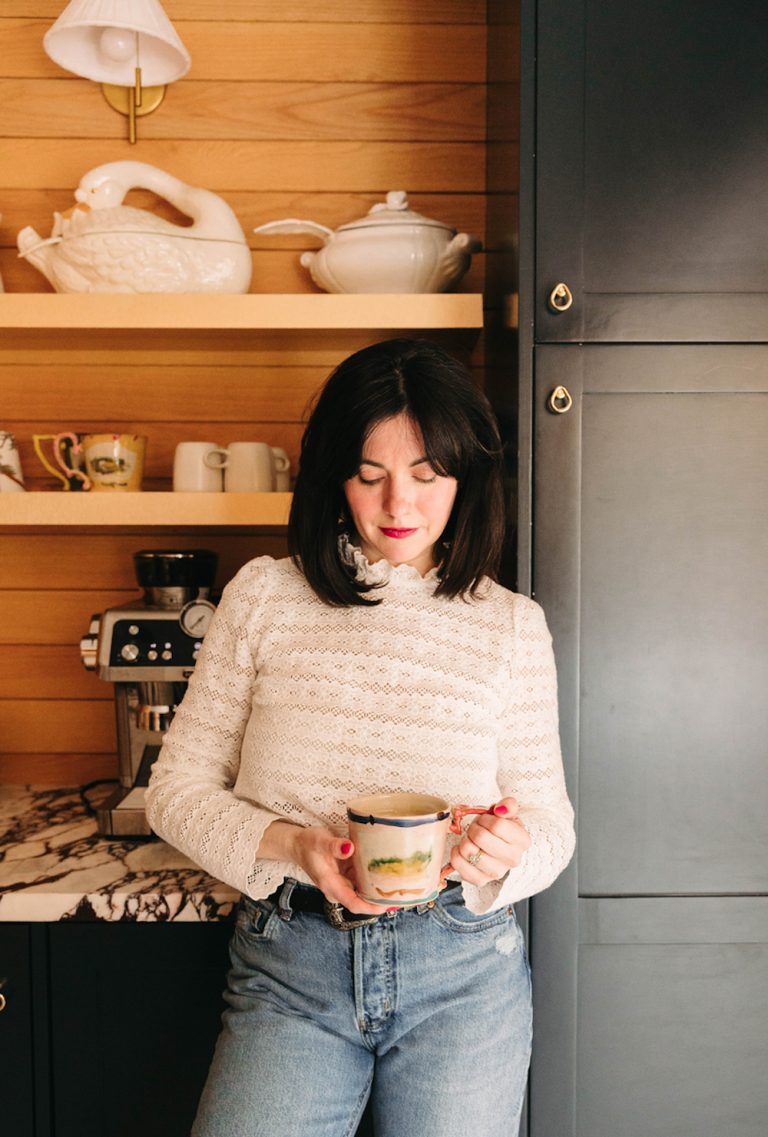 Woman drinking coffee.