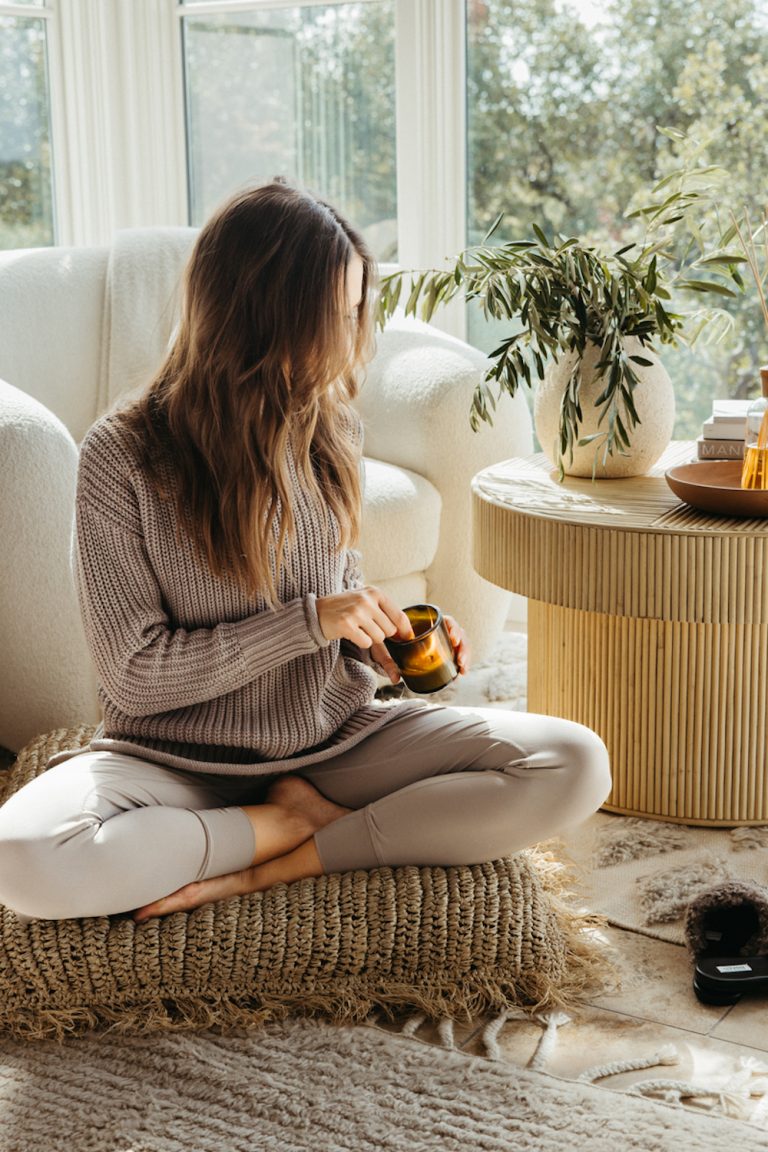 Woman lighting candle.