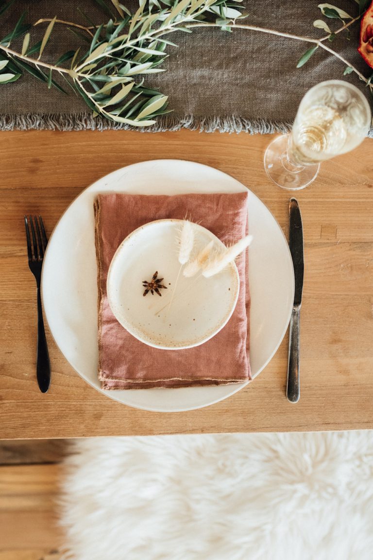 Minimalist, cozy Thanksgiving table setting.