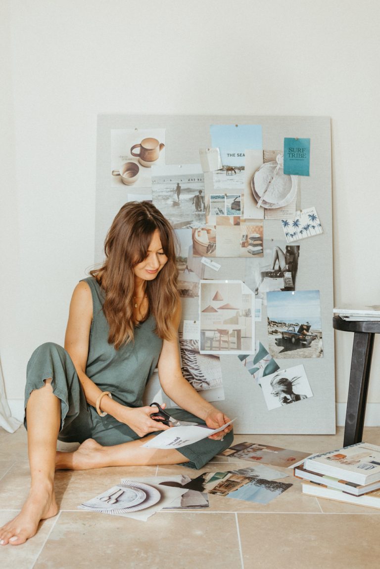 Woman making vision board.