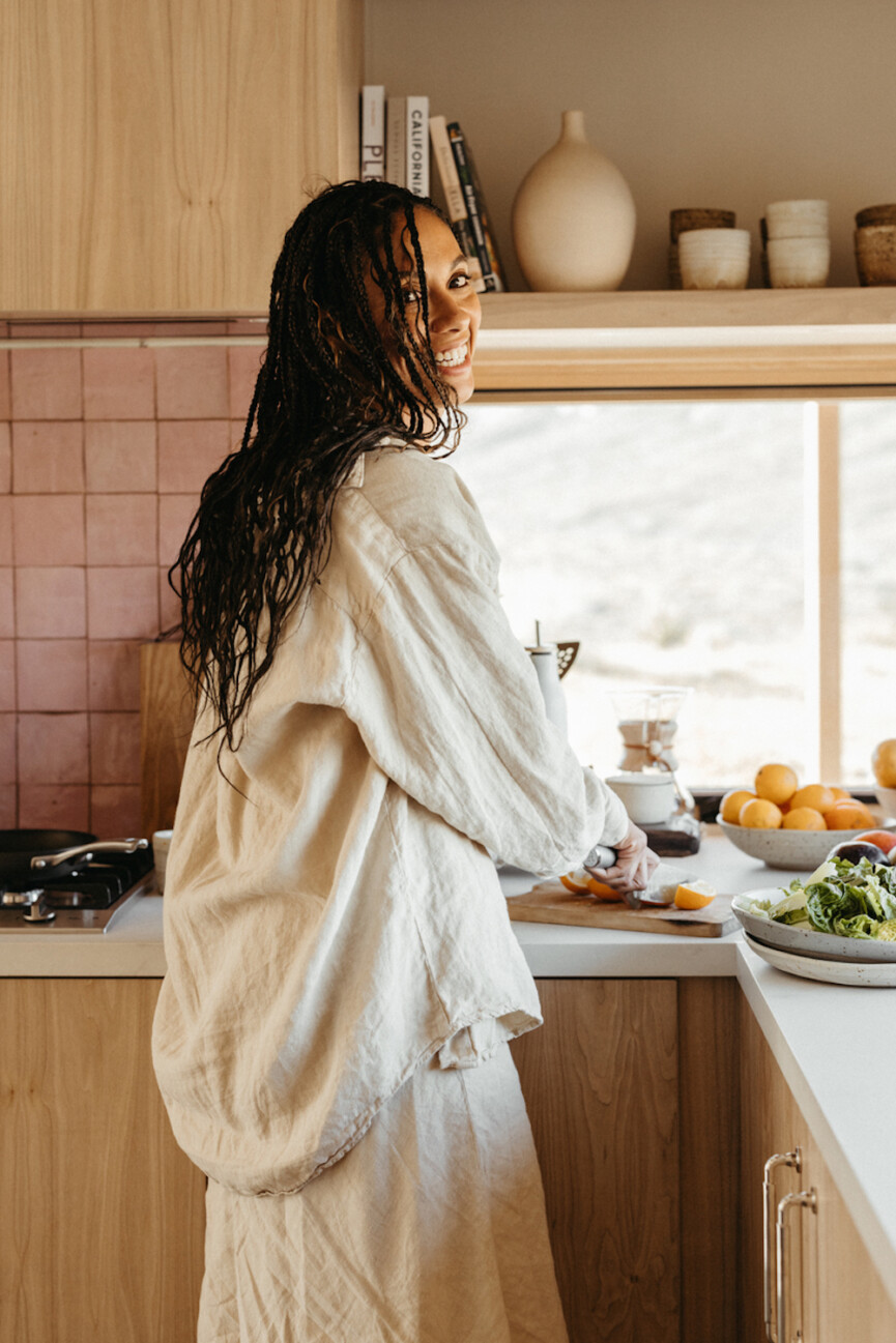 Woman cooking in kitchen.