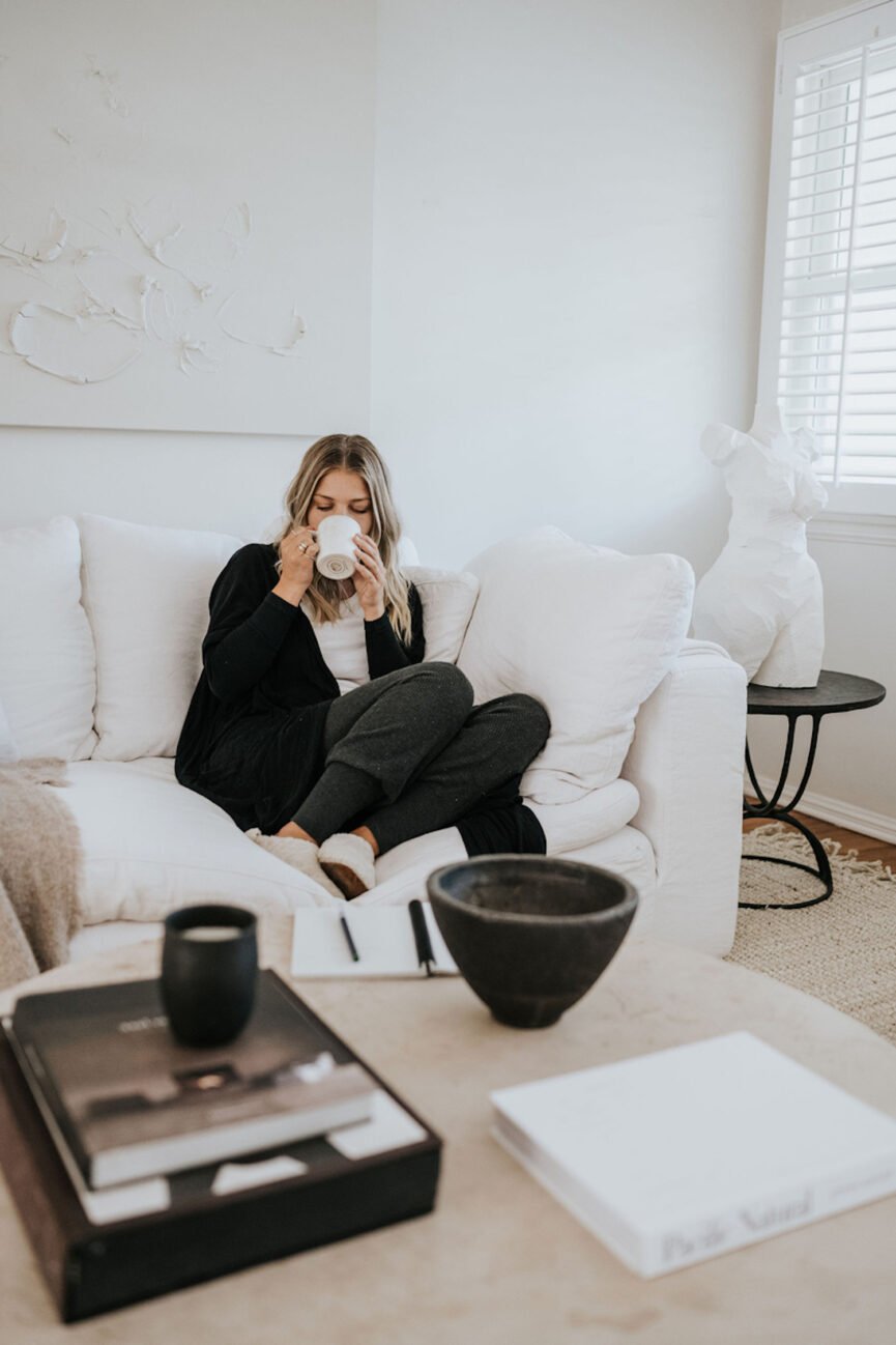 woman drinking tea on sofa