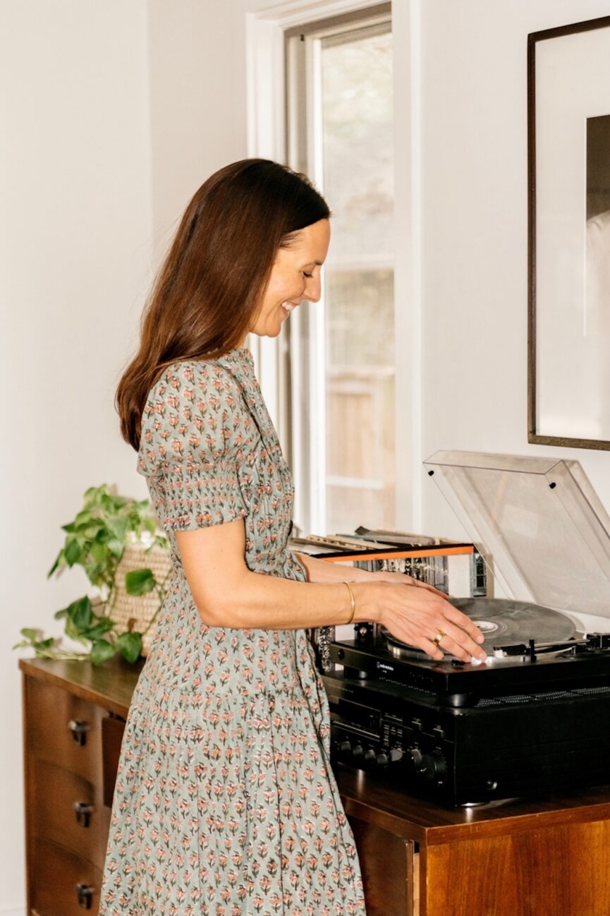 Woman playing records.