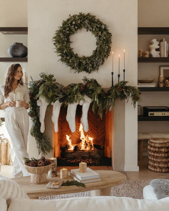 Camille Styles Holiday Decor 2023-Christmas Mantel with evergreen garland and casa zuma holiday wreath