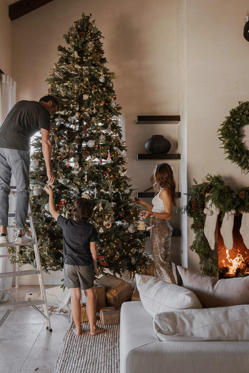 https://camillestyles.com/wp-content/uploads/2023/11/decorating-the-tree-things-to-do-in-december-865x1298.jpg