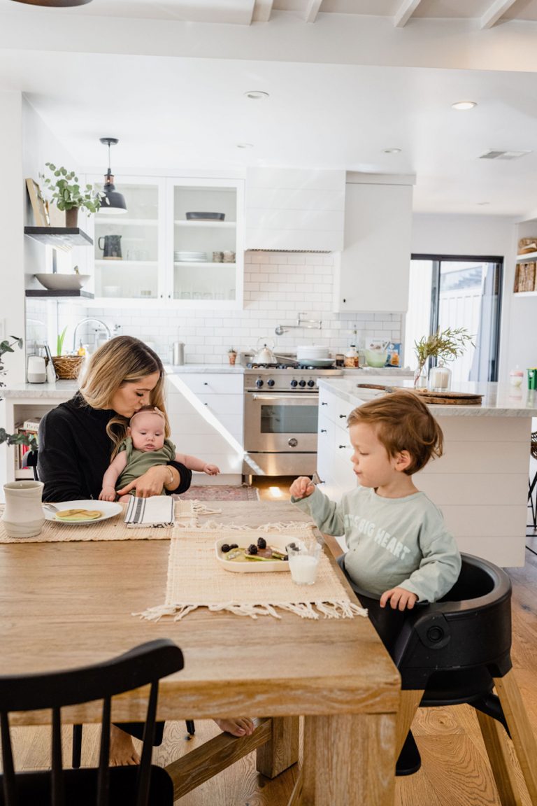 Mother and children at dining table.