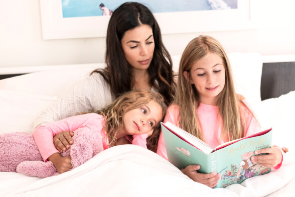 Mother reading to children.