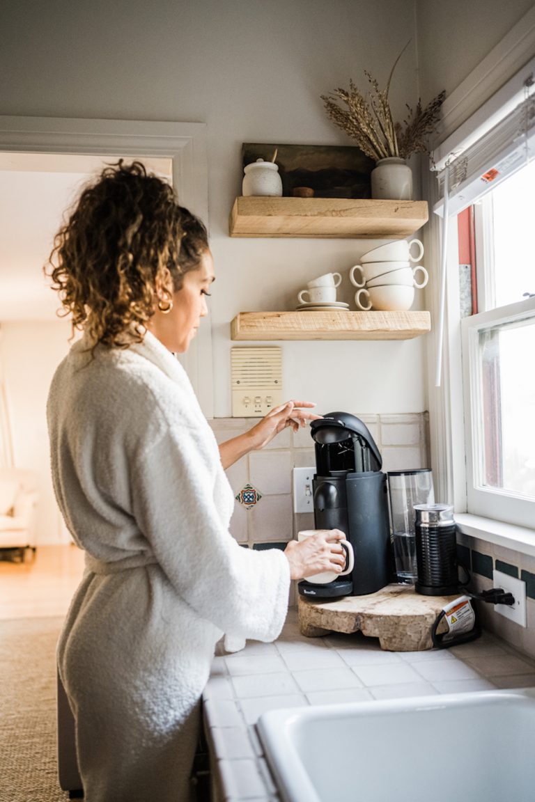 Woman making coffee.