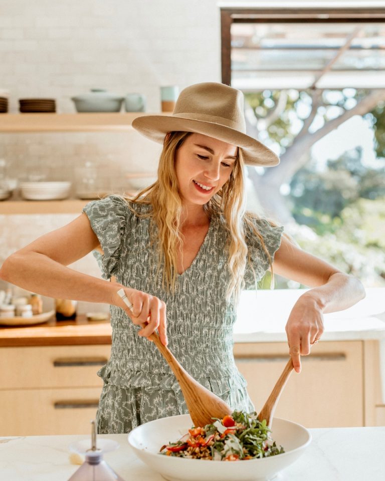 Woman making plant-based protein salad.