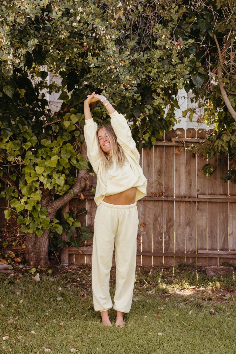 Woman stretching outside.