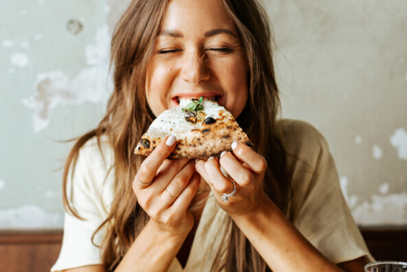 Camille eating pizza