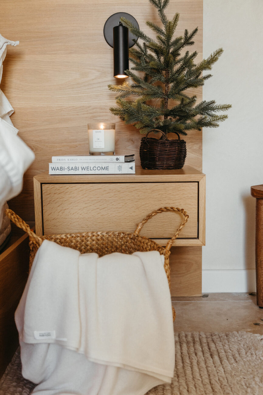 Small Christmas tree on nightstand.