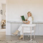 Woman reading at desk.