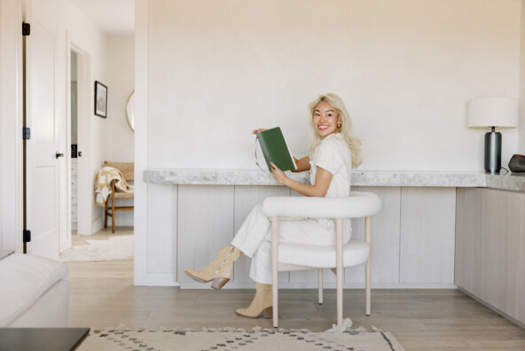 Woman reading at desk.