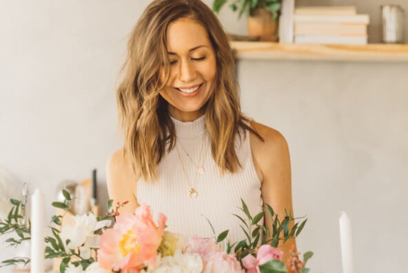 Camille Styles arranging flowers