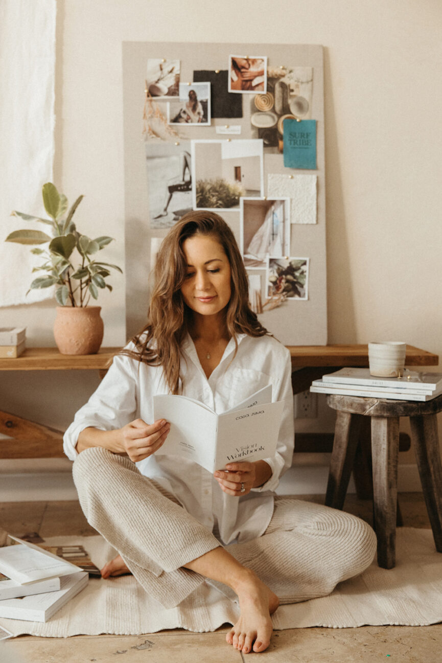 woman reading vision board ideas