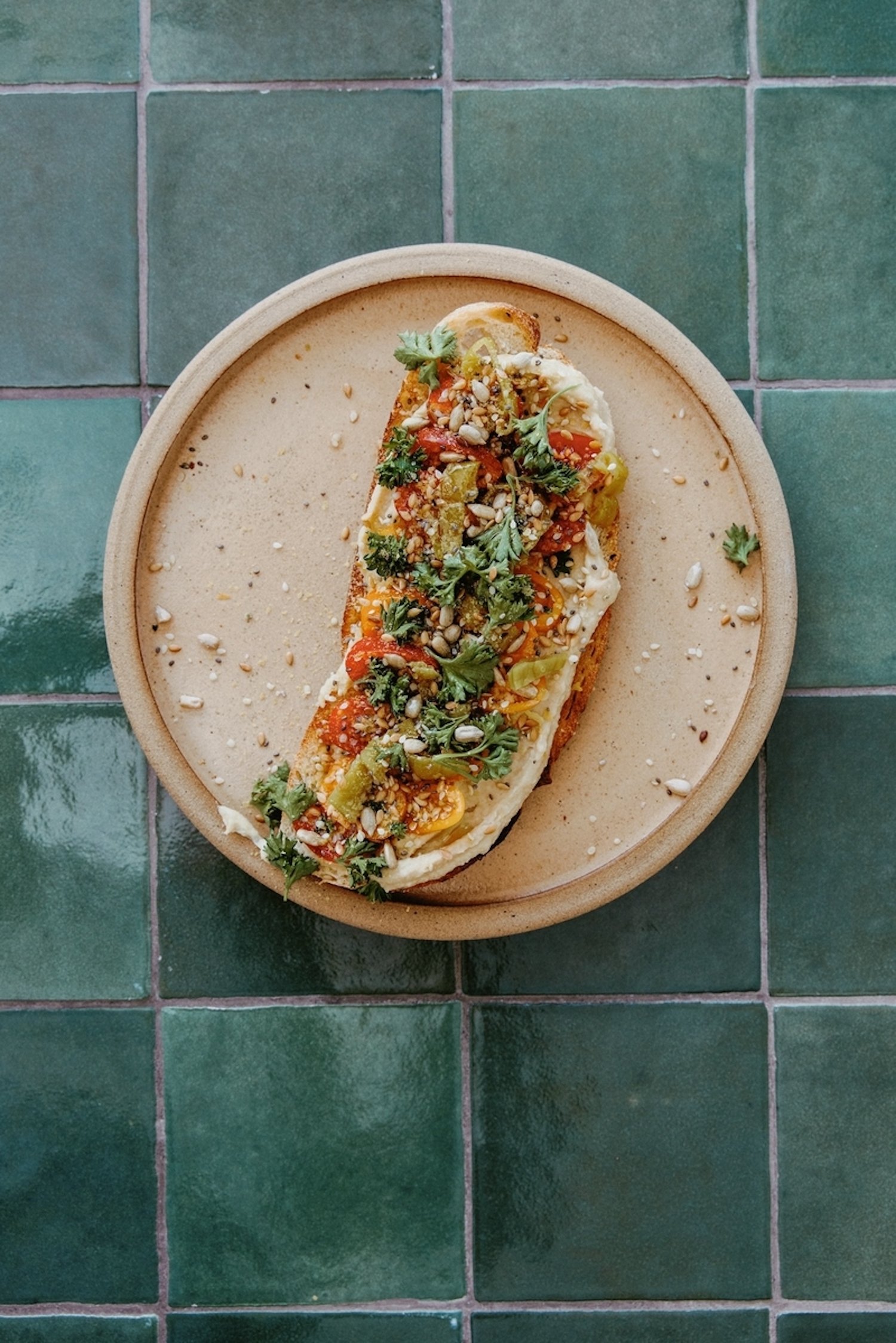 We’ll Be Starting Every Morning With This Nourishing Hummus Bruschetta